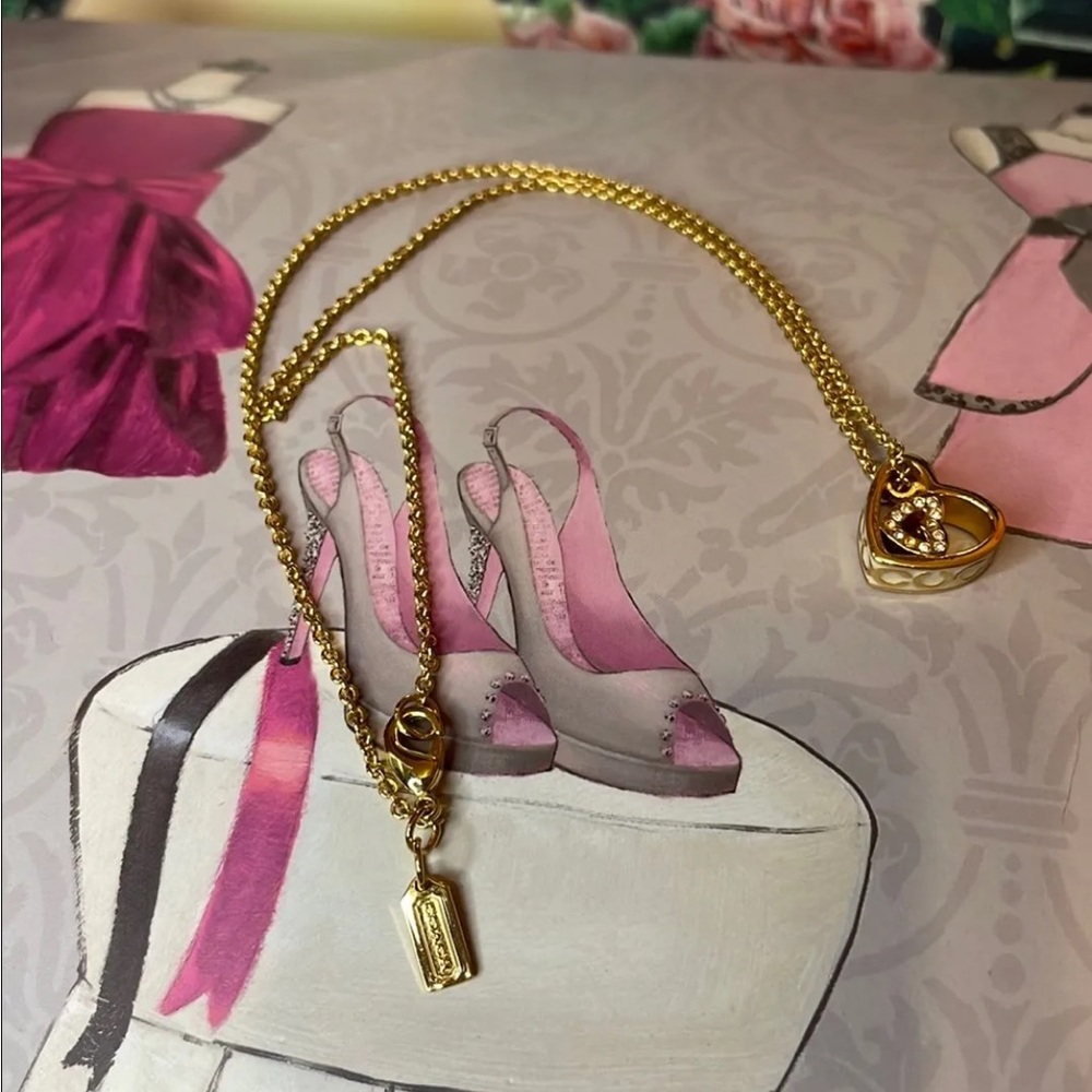 Coach Necklace with Heart Pendant. Gold tone and rhinestones.